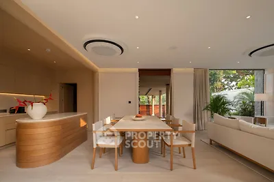 Luxurious open-plan living room with modern kitchen and elegant dining area
