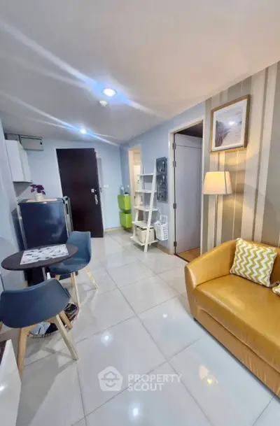 Modern living room with stylish decor and cozy seating in a contemporary apartment.