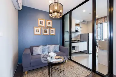 Modern living room with stylish decor and open kitchen layout in a contemporary apartment.