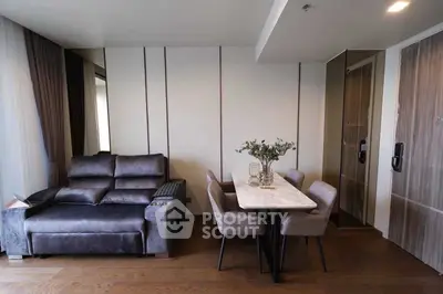 Modern living room with sleek furniture and elegant dining area, perfect for stylish urban living.