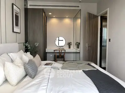 Modern bedroom with stylish decor and cozy ambiance, featuring a comfortable bed and elegant furnishings.
