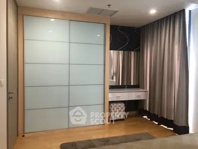Modern bedroom with sliding closet doors and elegant dressing table