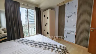 Modern bedroom with stylish decor and city view from window