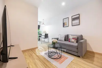Modern living room with stylish decor and cozy seating area, perfect for relaxation and entertainment.