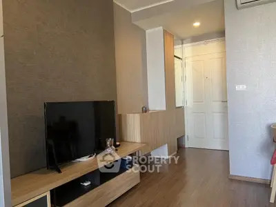 Modern living room with stylish wooden TV stand and sleek decor