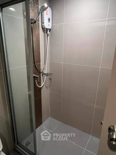 Modern bathroom with sleek shower enclosure and water heater