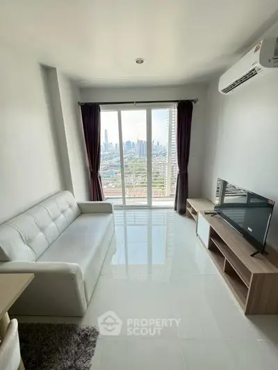 Modern living room with city view, featuring sleek white sofa and large window.