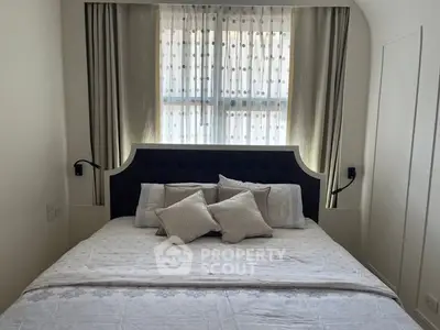 Cozy bedroom with elegant headboard and soft lighting