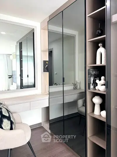 Stylish modern bedroom with mirrored wardrobe and elegant decor