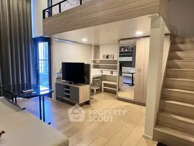 Modern loft apartment with mezzanine, stylish living area, and sleek wooden finishes.