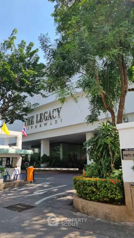 Welcome to The Legacy, a prestigious residential building surrounded by lush greenery and well-manicured gardens, offering a serene entrance that promises luxury and tranquility.