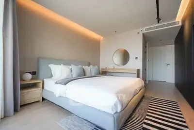Luxurious modern bedroom with stylish decor and ambient lighting