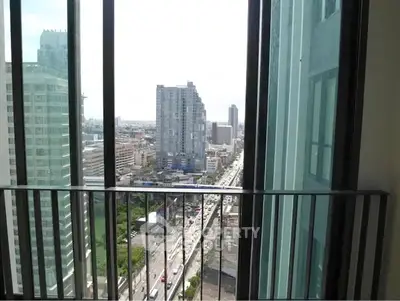 Stunning urban view from high-rise balcony with cityscape and skyline.