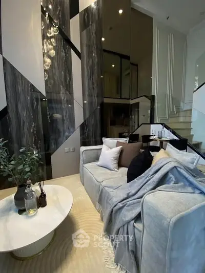 Luxurious modern living room with high ceilings and elegant decor