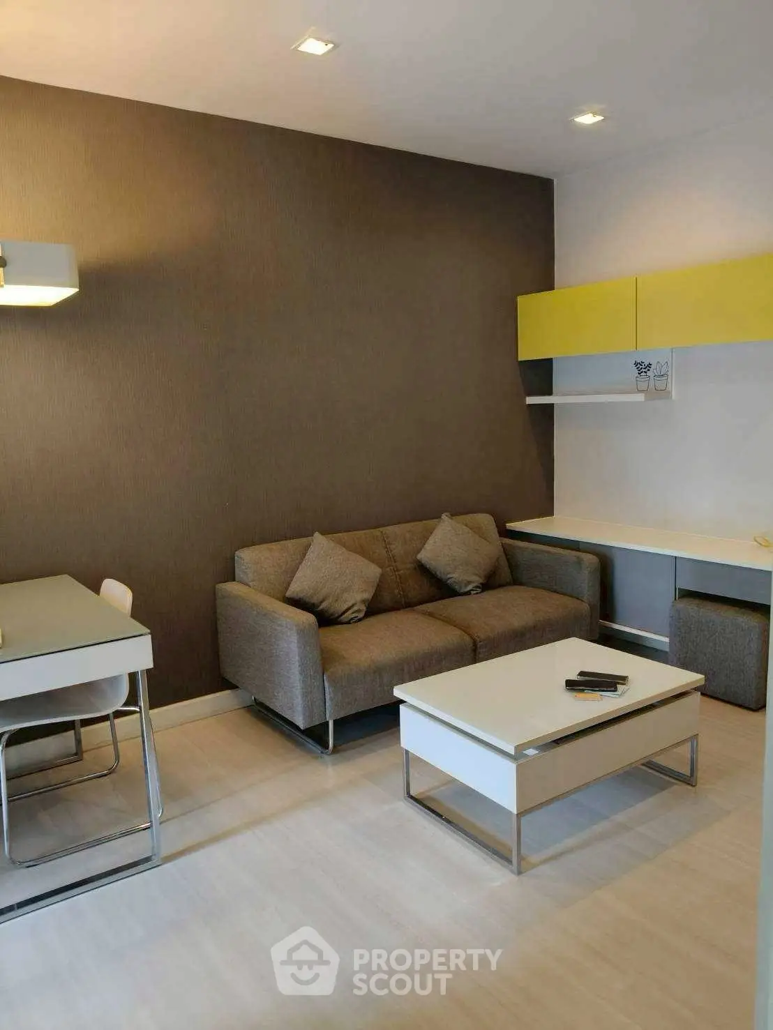 Modern living room with stylish furniture and neutral tones, perfect for relaxation and entertaining.