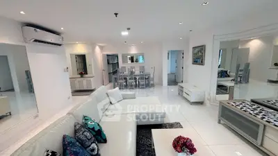 Spacious modern living room with elegant white decor and open layout