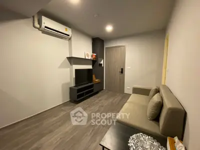 Modern living room with sleek design and air conditioning unit