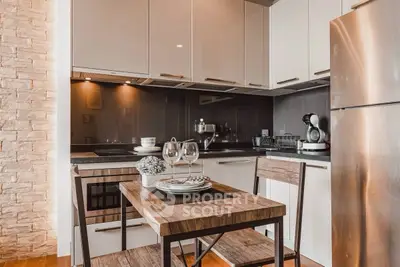 Modern kitchen with sleek cabinets and stainless steel appliances