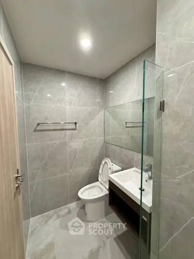 Modern bathroom with sleek design and glass shower partition