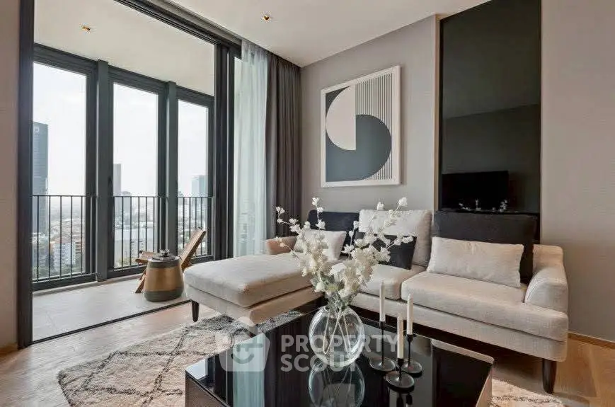 Luxurious living room with modern decor and balcony view in high-rise apartment.