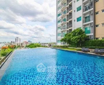 Luxurious high-rise building with stunning infinity pool and city view.