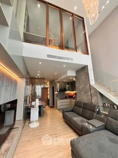 Luxurious modern living room with high ceiling and elegant decor