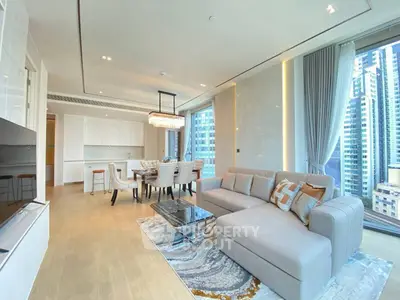 Luxurious modern living room with elegant dining area and stunning city view.