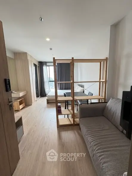 Modern open-plan living room with stylish furniture and natural light