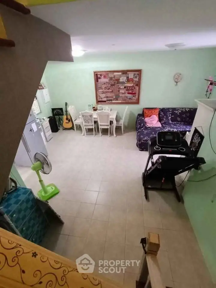 Spacious living room with cozy seating and dining area, ideal for family gatherings.