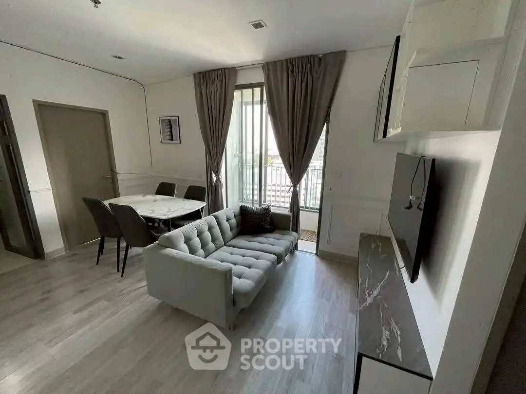 Modern living room with stylish furniture and natural light