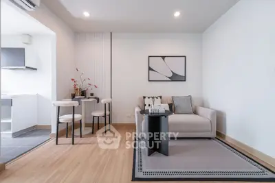 Modern living room with stylish decor and open kitchen layout