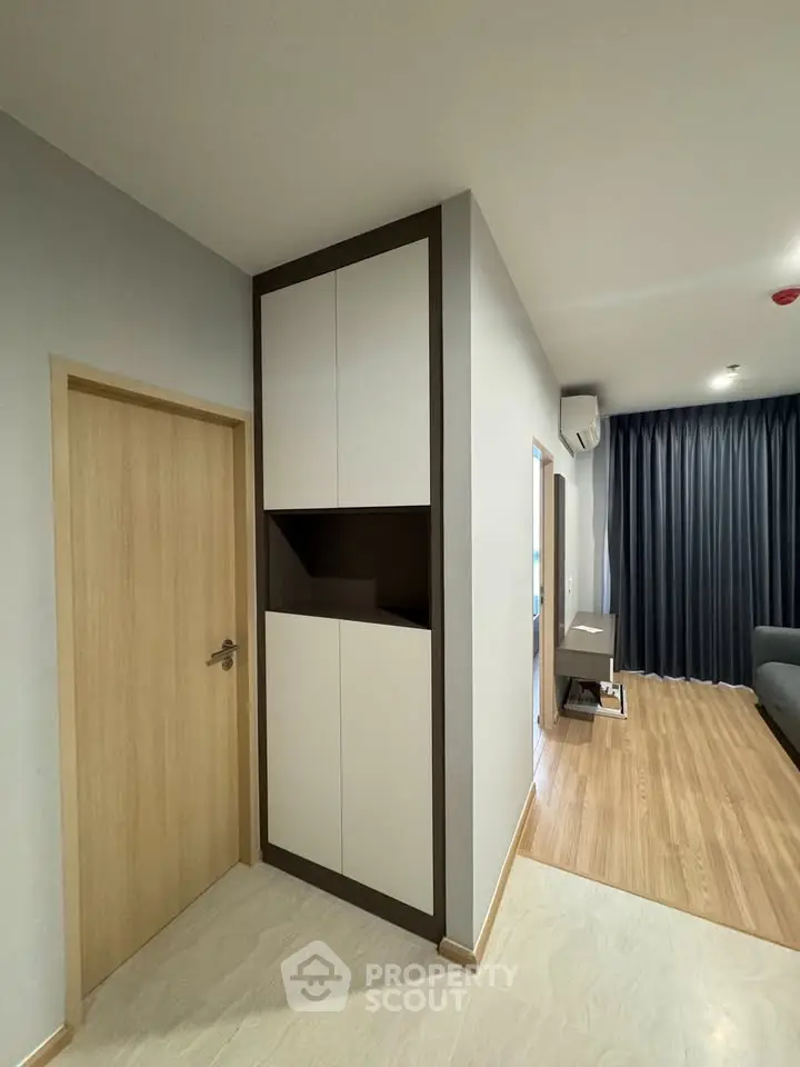 Modern apartment interior with sleek storage and open living area