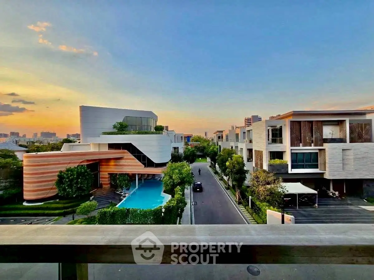 Luxurious modern villas with stunning sunset view and private pool in an upscale neighborhood.