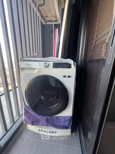 Modern balcony with Samsung washing machine and city view