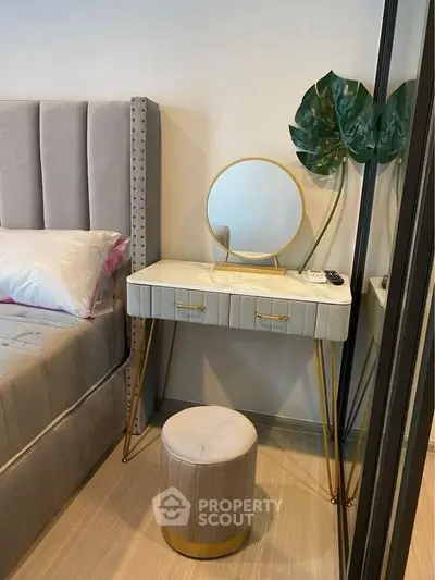 Elegant bedroom with plush bed and chic vanity set, perfect for modern living.