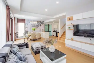 Spacious modern living room with stylish decor and open layout, perfect for entertaining.