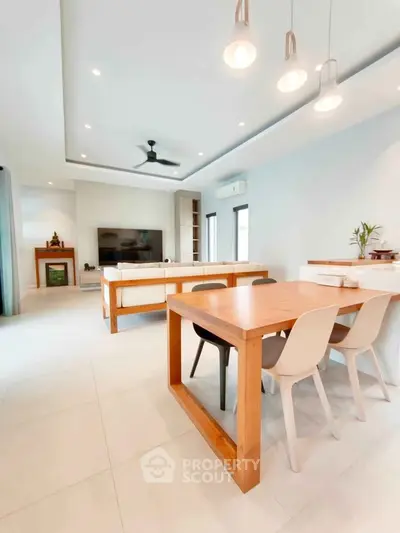 Spacious modern living room with dining area and stylish furniture