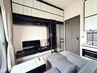 Modern living room with sleek furniture and built-in storage solutions