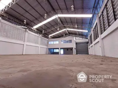 Spacious industrial warehouse with high ceilings and ample natural light