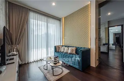 Luxurious modern living room with elegant decor and large windows for natural light.