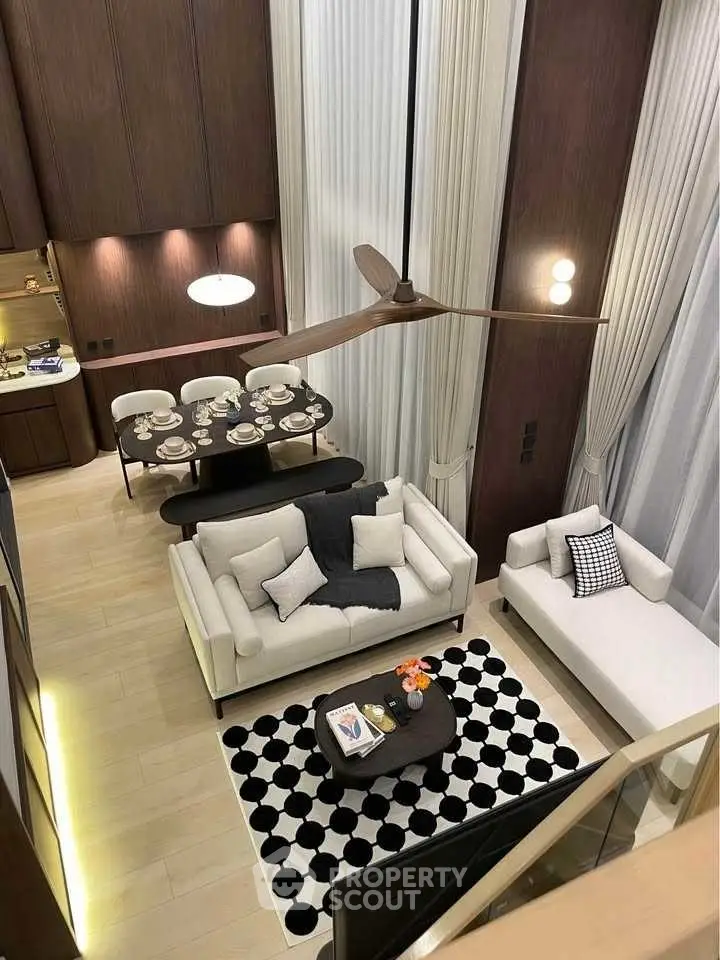 Luxurious modern living room with high ceilings and elegant decor