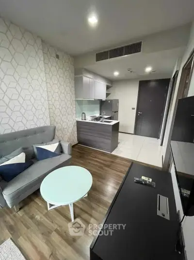 Modern living room with open kitchen and stylish decor