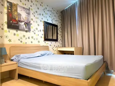 Cozy bedroom with modern decor and stylish wallpaper