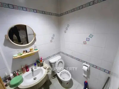 Cozy bathroom with modern fixtures and decorative tile accents
