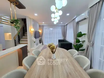 Spacious modern living room with elegant dining area and stylish decor