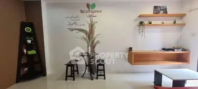 Charming interior with minimalist decor and stylish shelving in a cozy living space.