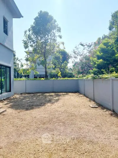 Spacious backyard with potential for landscaping in suburban home