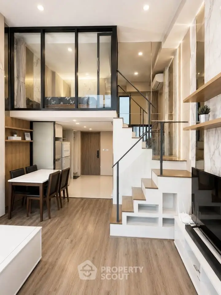 Modern duplex apartment with stylish open layout and elegant staircase