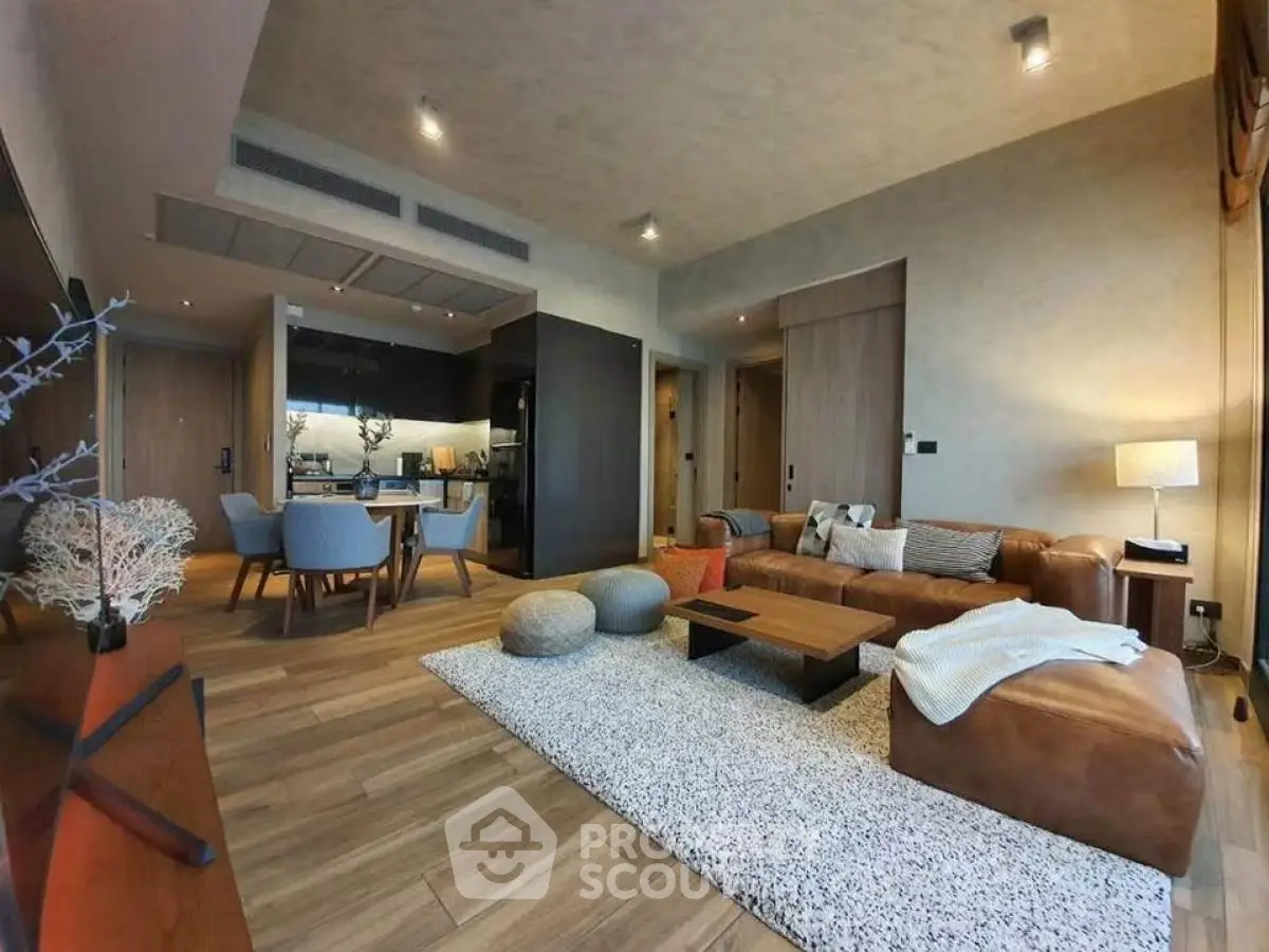 Spacious modern living room with open kitchen and stylish decor