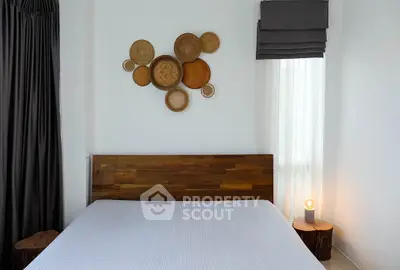 Cozy bedroom with wooden headboard and artistic wall decor